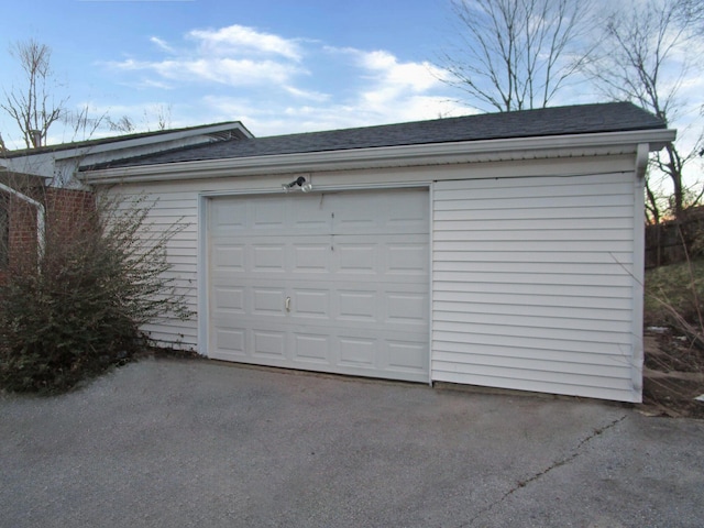 garage featuring driveway