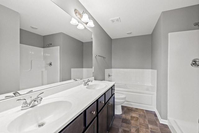 bathroom with a garden tub, a sink, baseboards, and double vanity