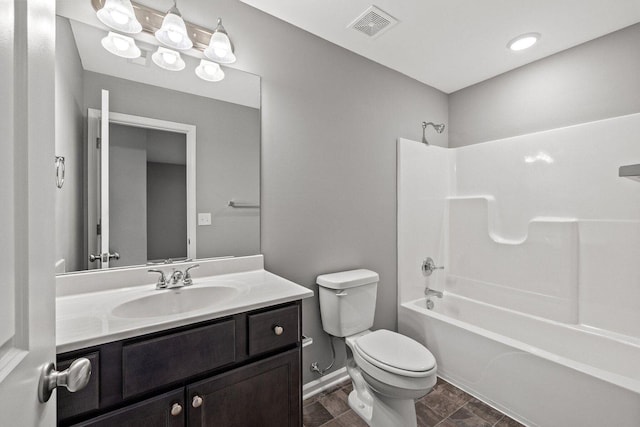 bathroom featuring baseboards, visible vents, toilet, vanity, and shower / washtub combination