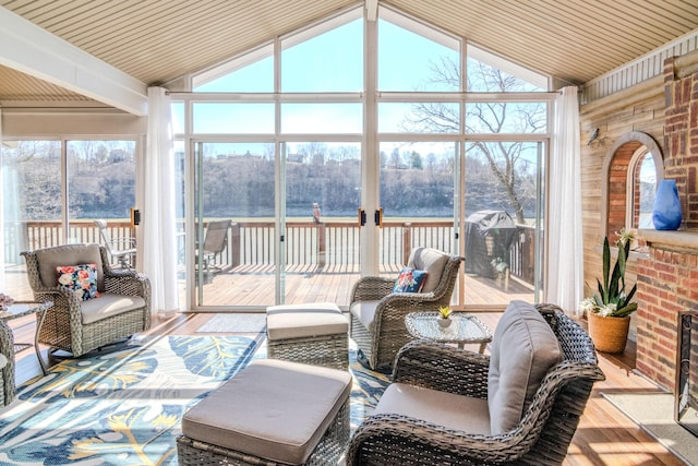 sunroom featuring vaulted ceiling