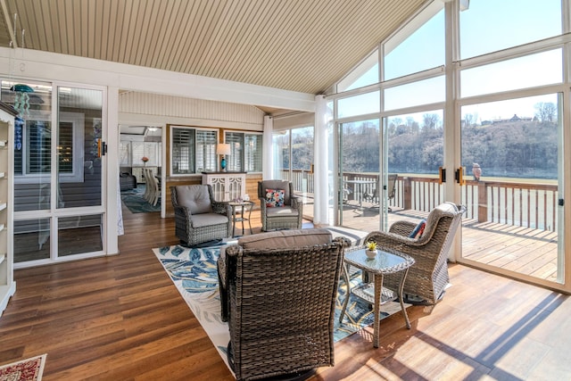 sunroom with lofted ceiling and visible vents