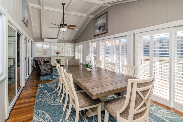 sunroom with vaulted ceiling with beams and a ceiling fan