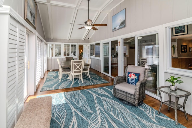 sunroom with a ceiling fan and lofted ceiling