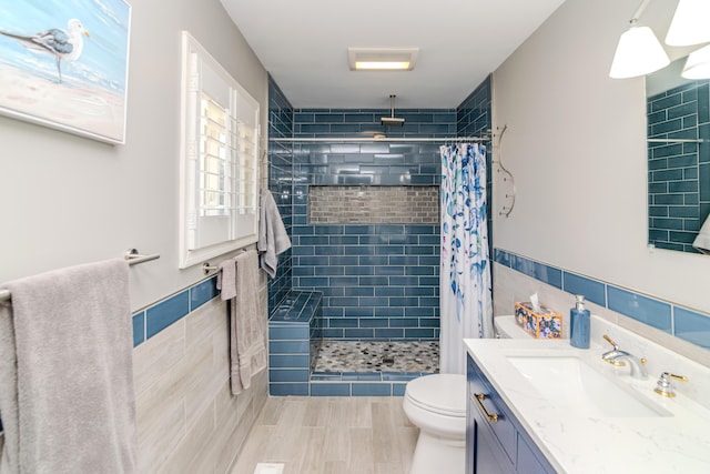 bathroom featuring tile walls, toilet, and tiled shower