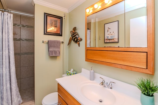 bathroom featuring tiled shower, toilet, vanity, and crown molding