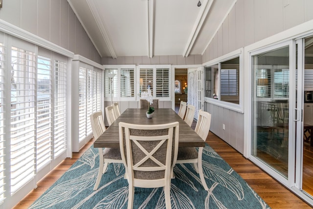 sunroom with lofted ceiling with beams