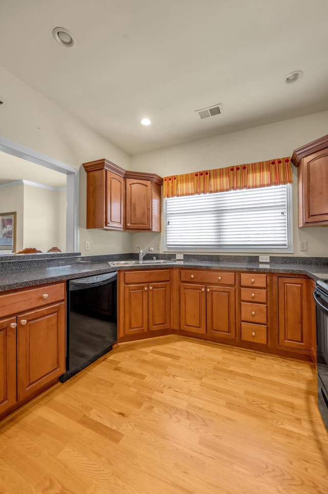 kitchen with light wood-type flooring, a healthy amount of sunlight, visible vents, and dishwasher