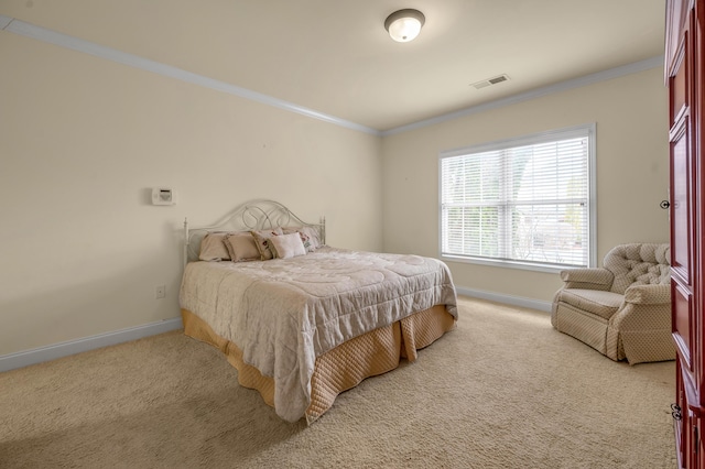 bedroom with ornamental molding, visible vents, and light colored carpet
