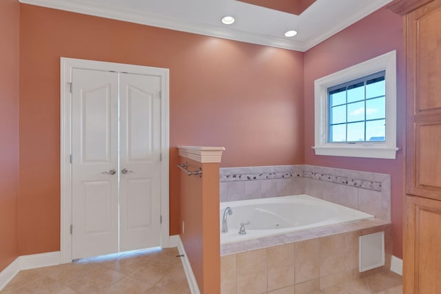 bathroom with tile patterned flooring, crown molding, baseboards, and a bath