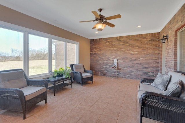 sunroom / solarium with ceiling fan