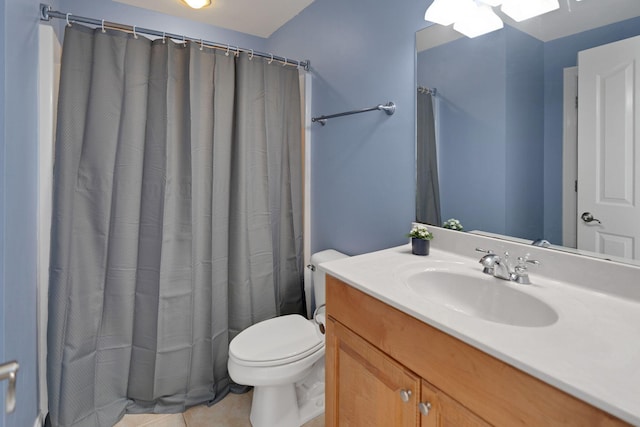 bathroom with toilet, a shower with curtain, vanity, and tile patterned floors