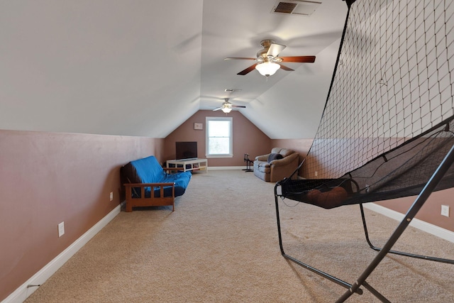 unfurnished bedroom featuring vaulted ceiling, carpet floors, visible vents, and baseboards