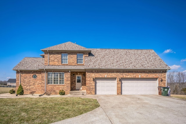 view of front of property with a garage, driveway, roof with shingles, a front yard, and brick siding