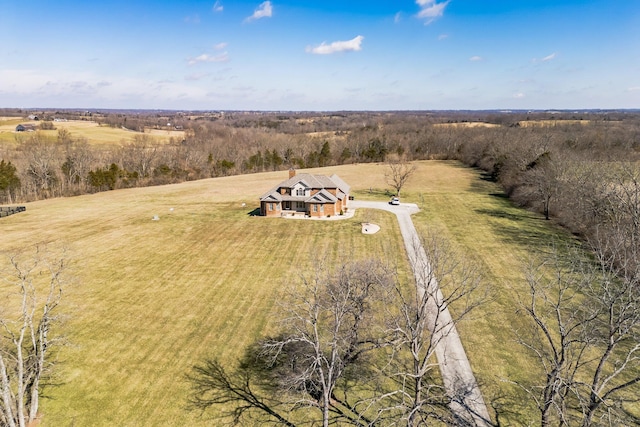 birds eye view of property with a rural view