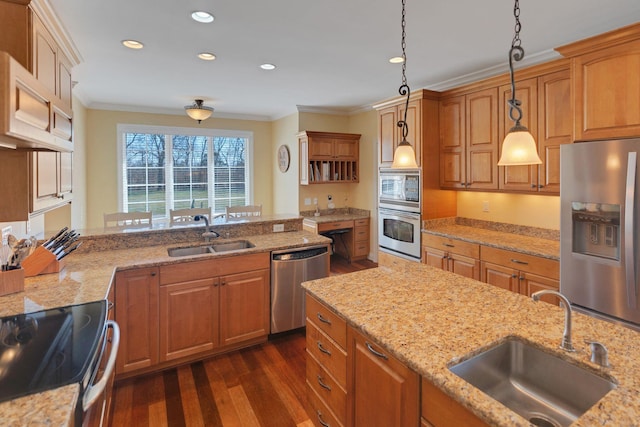 kitchen with stainless steel appliances, a sink, and ornamental molding