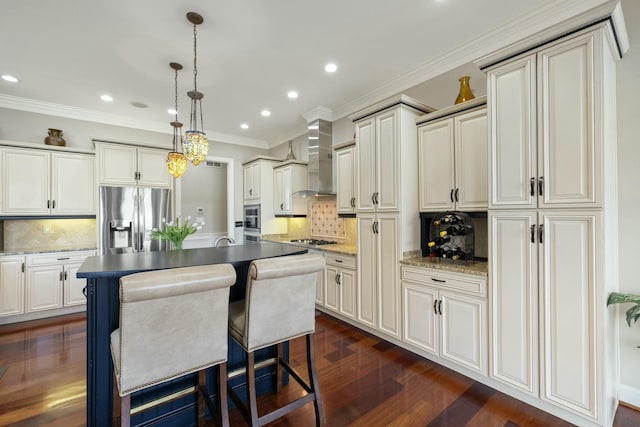 kitchen with crown molding, dark wood-type flooring, a center island with sink, stainless steel appliances, and wall chimney exhaust hood