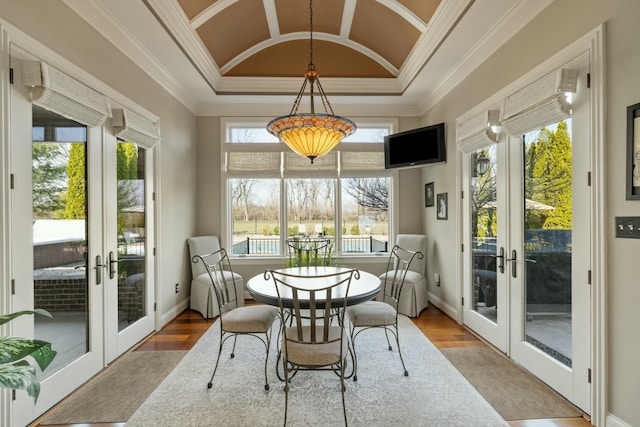 sunroom featuring french doors and vaulted ceiling