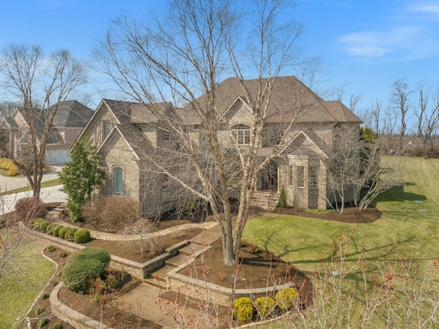 french country home featuring a front yard