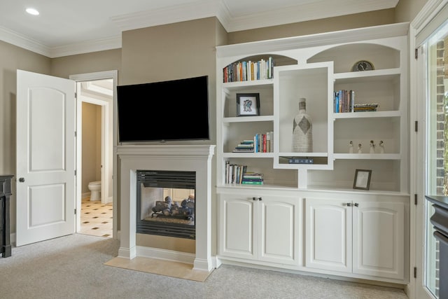 living room with light carpet, built in shelves, a multi sided fireplace, crown molding, and baseboards