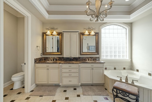 full bathroom featuring a chandelier, ornamental molding, double vanity, a raised ceiling, and a sink