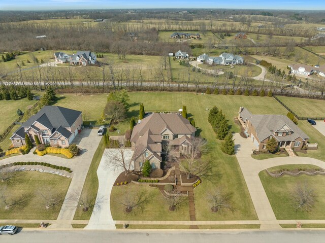 drone / aerial view featuring a residential view and a rural view