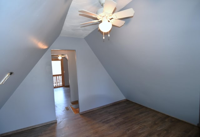 additional living space featuring lofted ceiling and wood finished floors