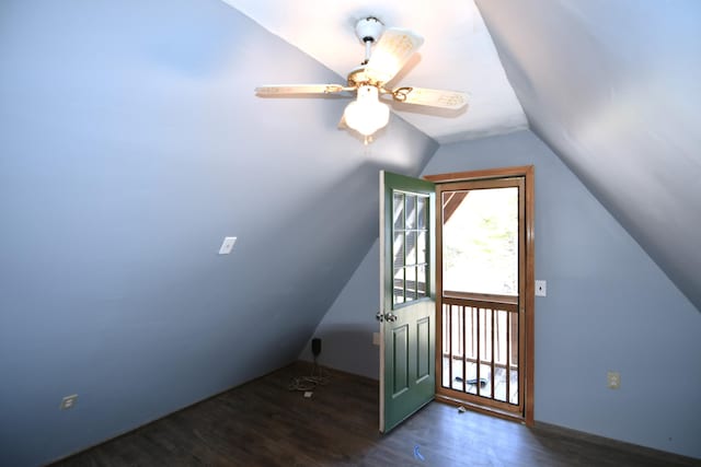 additional living space featuring lofted ceiling, wood finished floors, and a ceiling fan