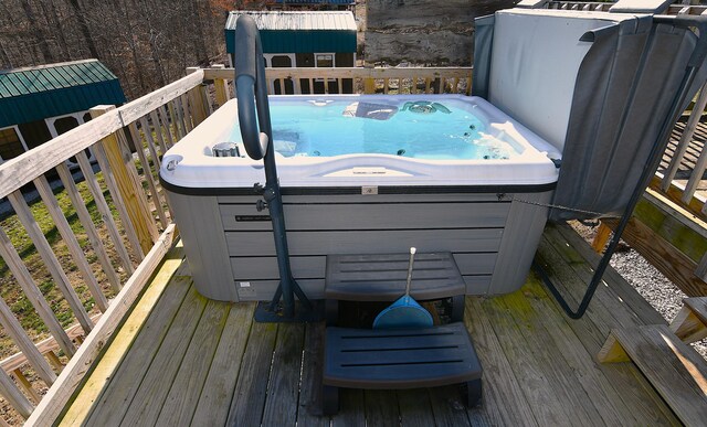 wooden terrace featuring a hot tub