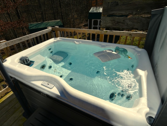 wooden terrace with a hot tub