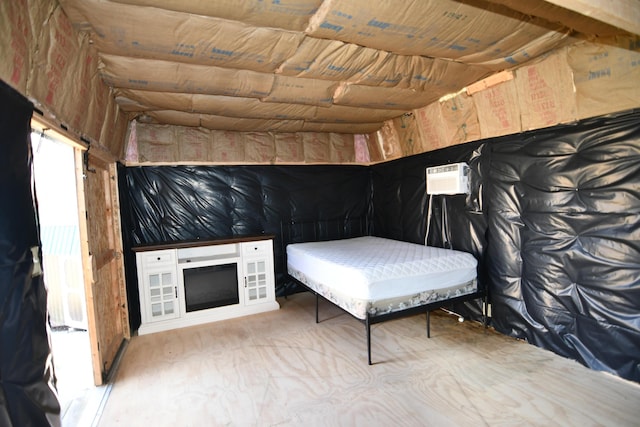 unfurnished bedroom featuring a wall unit AC and wood ceiling