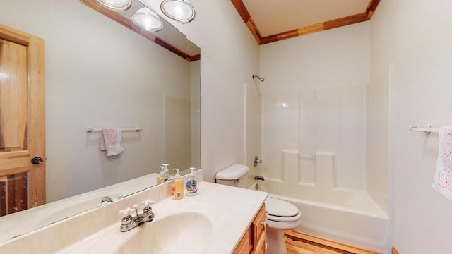 bathroom featuring  shower combination, crown molding, vanity, and toilet