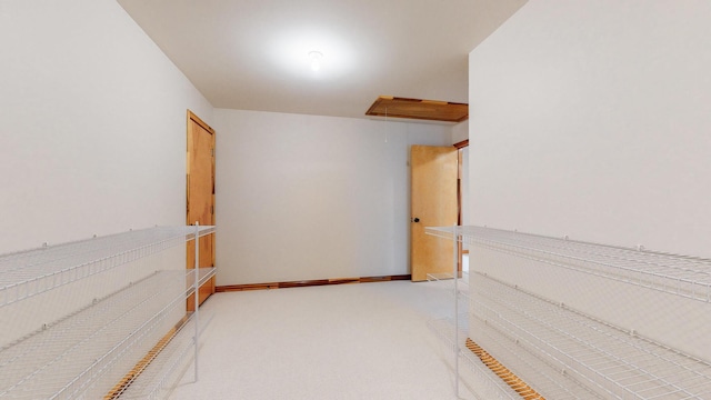 storage room featuring attic access