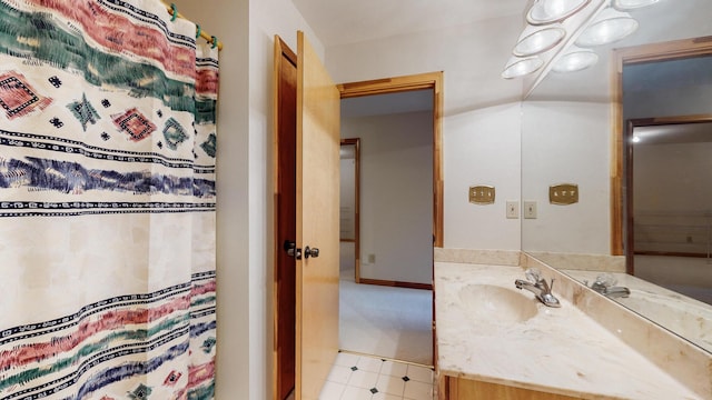 full bathroom featuring a shower with shower curtain, tile patterned floors, and vanity