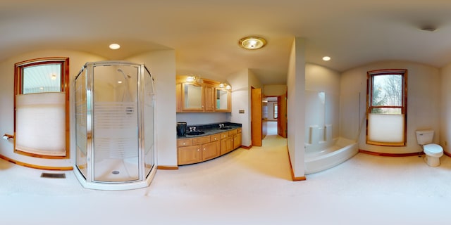 full bathroom featuring recessed lighting, a shower stall, vanity, and baseboards