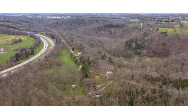 birds eye view of property with a rural view