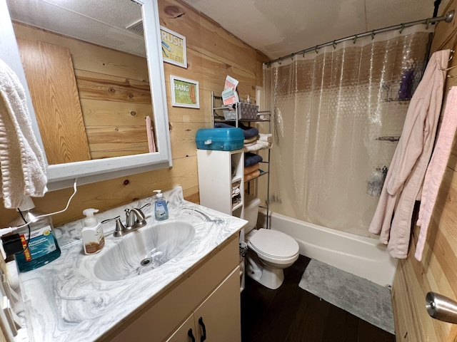 full bath featuring vanity, shower / bath combination with curtain, toilet, and wooden walls