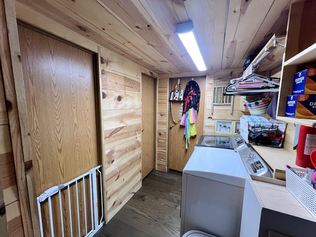 washroom featuring laundry area, washing machine and clothes dryer, wood ceiling, and wooden walls