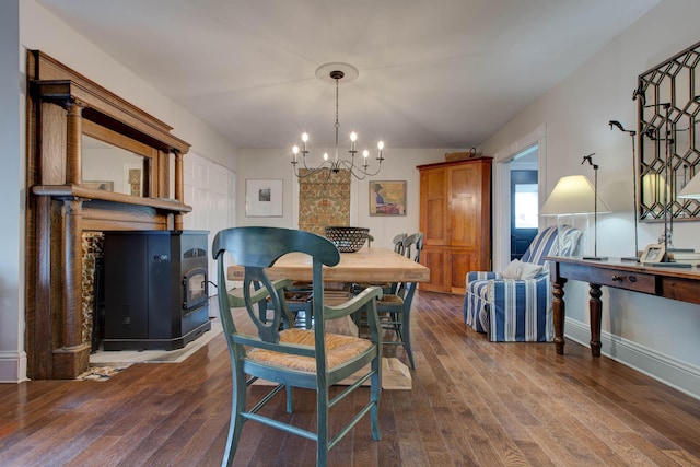 dining room featuring dark wood-type flooring and a notable chandelier