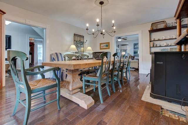 dining area with dark wood-style floors and ceiling fan