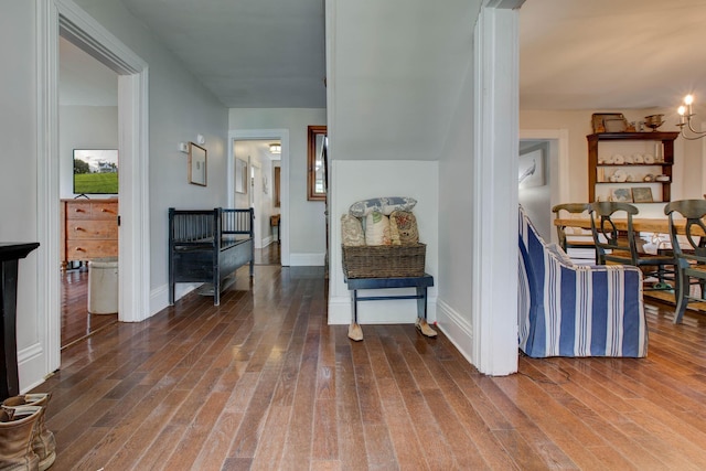 interior space with baseboards and wood finished floors