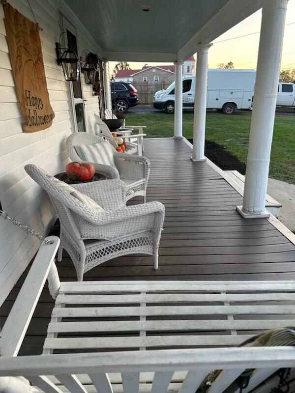 wooden terrace featuring covered porch