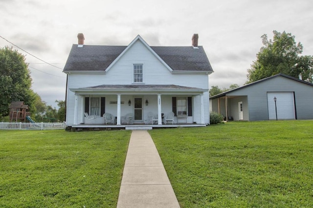 farmhouse with a porch, a front yard, fence, and a chimney