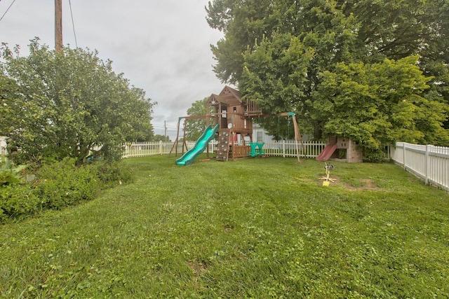 view of jungle gym with a yard and a fenced backyard