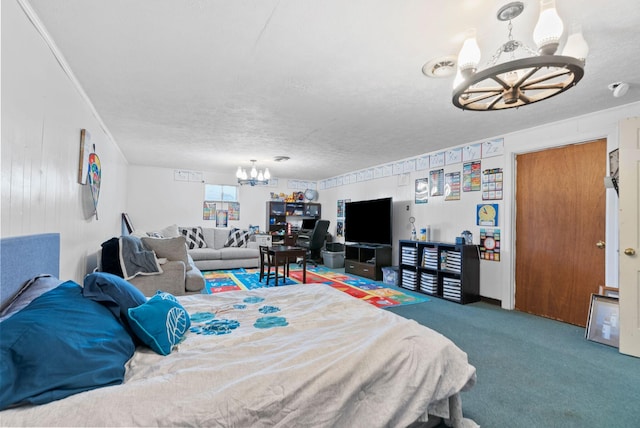 carpeted bedroom with crown molding, a textured ceiling, and an inviting chandelier