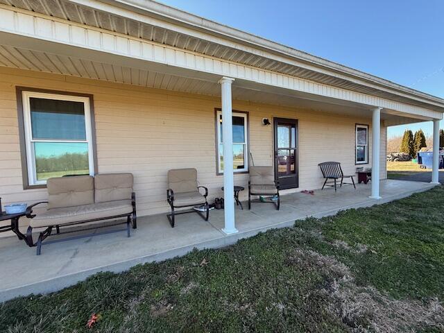 view of patio featuring a porch