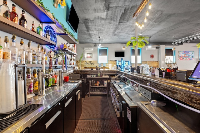 interior space featuring open shelves, stainless steel counters, and tile patterned flooring