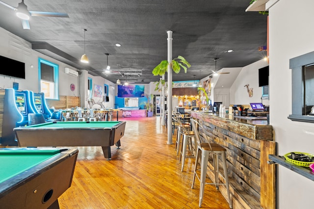 playroom featuring wood finished floors, ceiling fan, a dry bar, and billiards