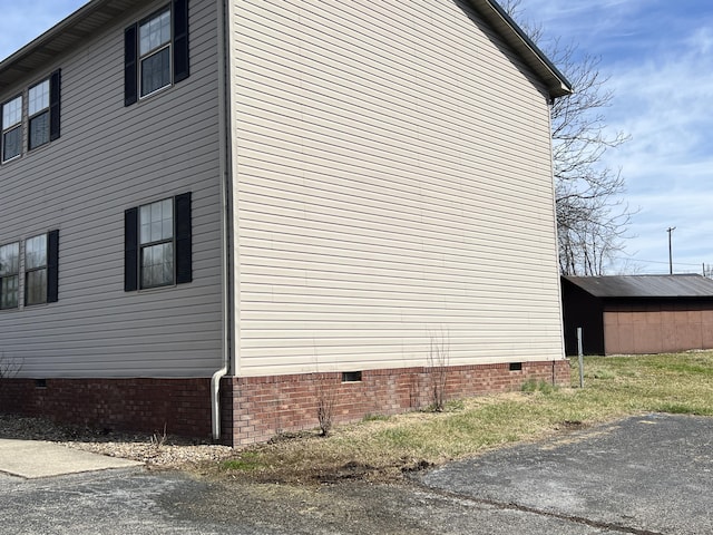 view of side of property featuring crawl space