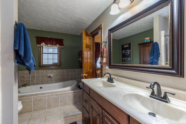 full bath with double vanity, a garden tub, a textured ceiling, and a sink