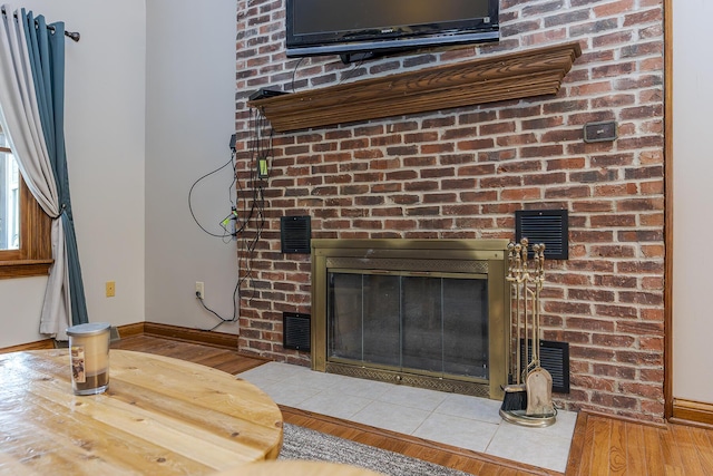 interior details featuring visible vents, a fireplace, and baseboards